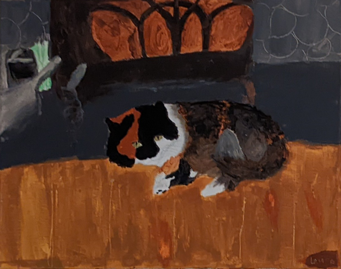 Curious cat looking at fish in the fishbowl